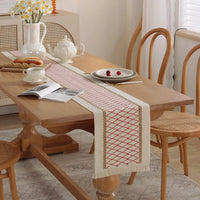 Boho beige table runner with geometric patterns and tassels