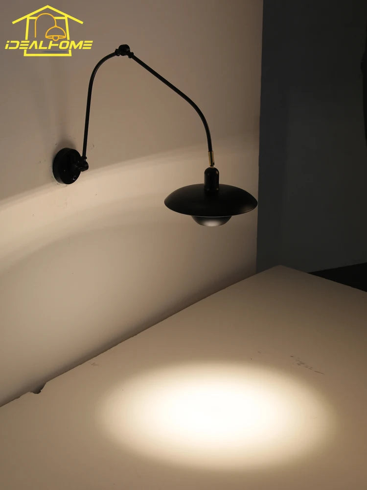 Industrial wall light with adjustable swing arm for indoor lighting