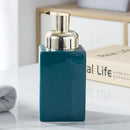 ceramic soap dispenser with gold pump for bathroom