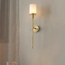 Natural marble wall light with brass bulb