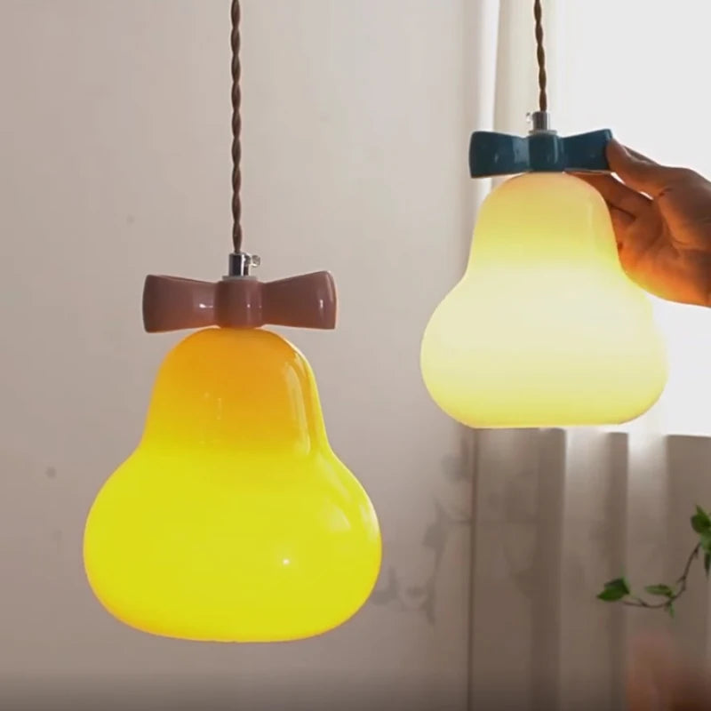 Glass pendant light with pink bow for children's room