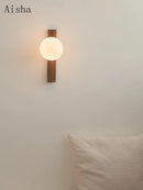 Retro walnut wall light with decorative glass