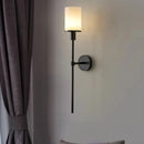 Natural marble wall light with brass bulb