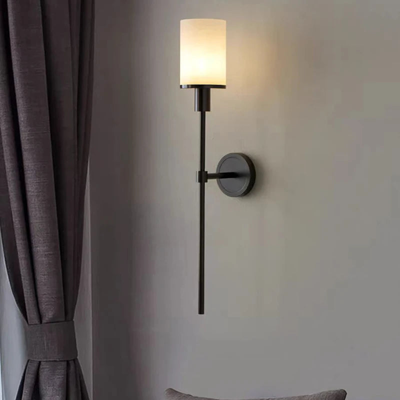 Natural marble wall light with brass bulb
