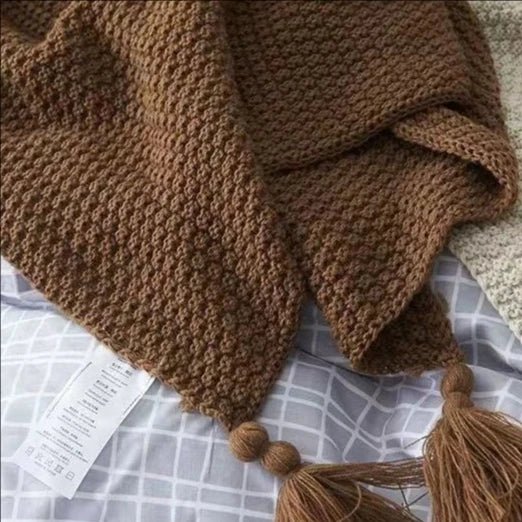 Waffle knit chunky throw with pom poms nordic style