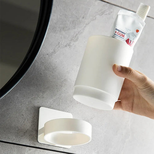 Wall-mounted organiser for toothbrushes and cup