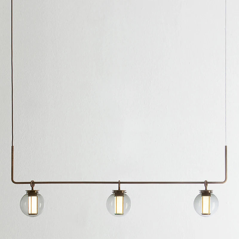 Minimalist glass pendant light for creative and retro spaces