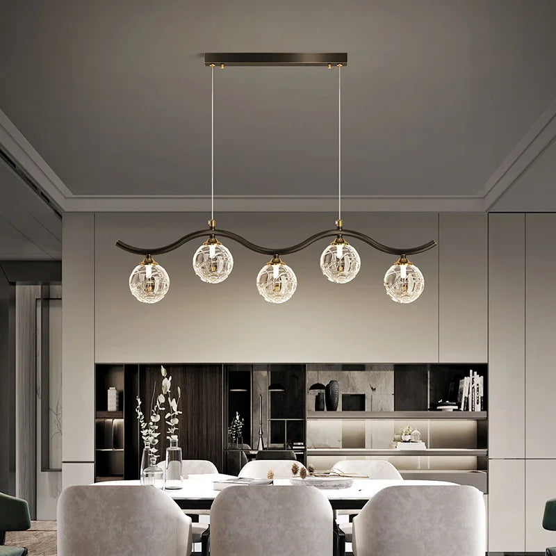 Modern glass and metal pendant light for interiors