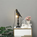 Modern resin bird-shaped desk lamp with golden beak
