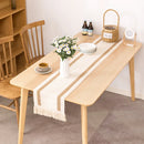 Linen-effect table runner with decorative check pattern