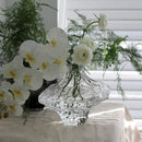 glass vase with decorative stones for flowers and terrarium