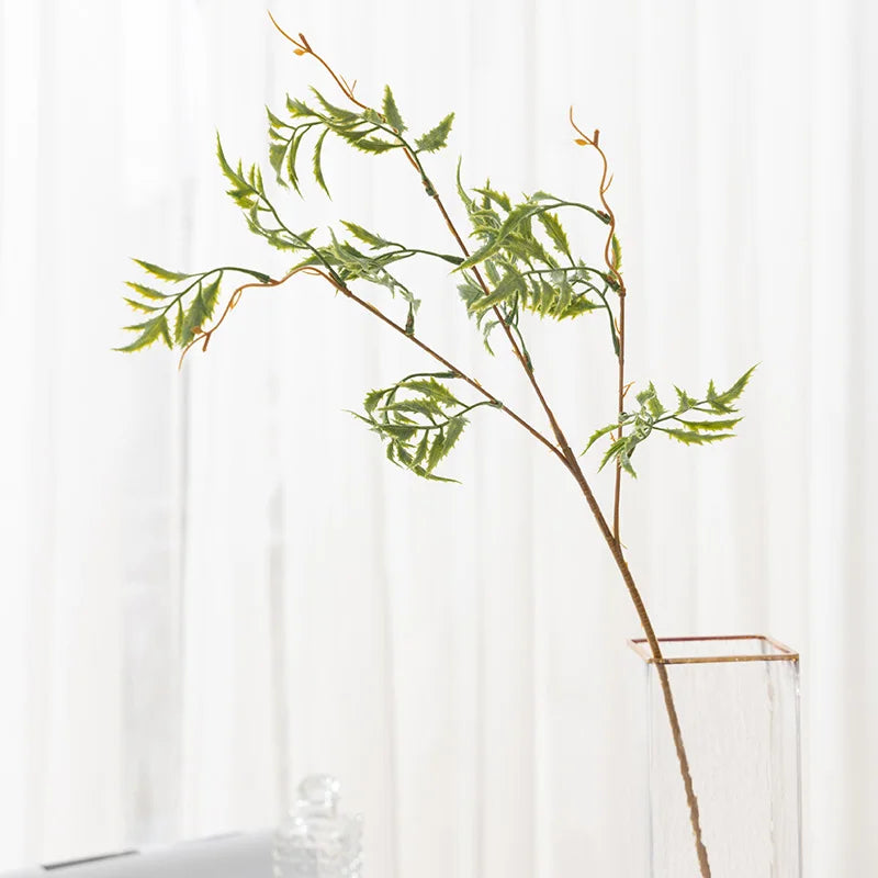 Artificial fern branch for festive and event decorations