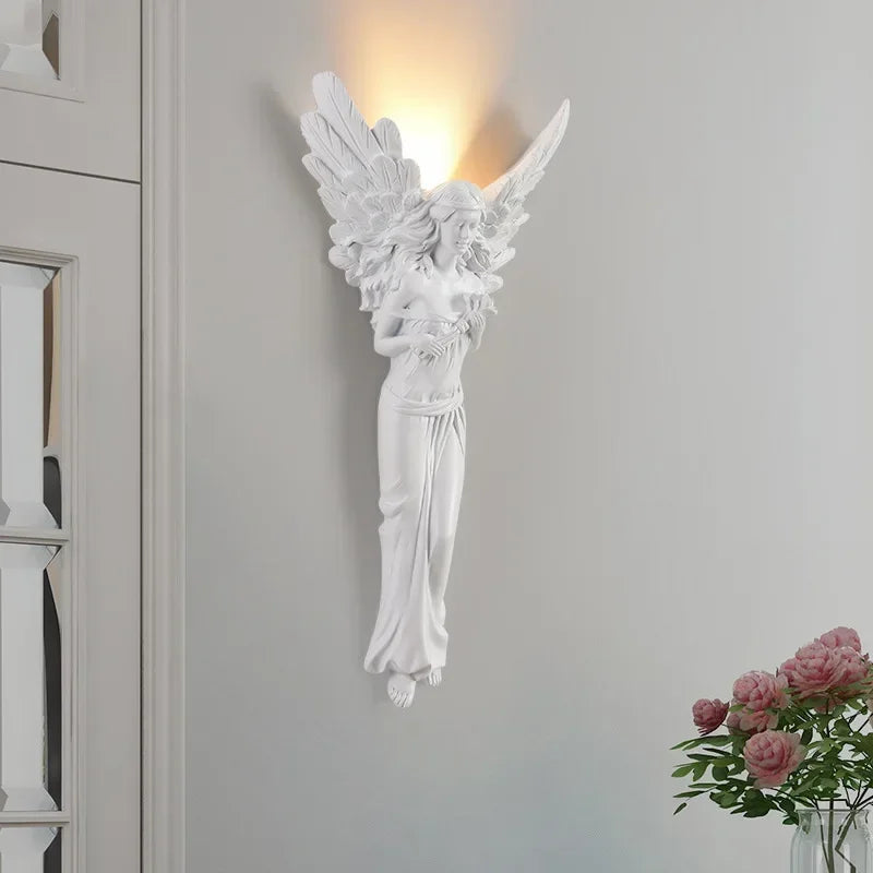 Decorative sculpted angel resin LED wall light