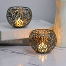 Gold metal candle holders with intricate design for elegant decor