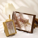 Transparent floating photo frame with dried flowers, decorative and handmade