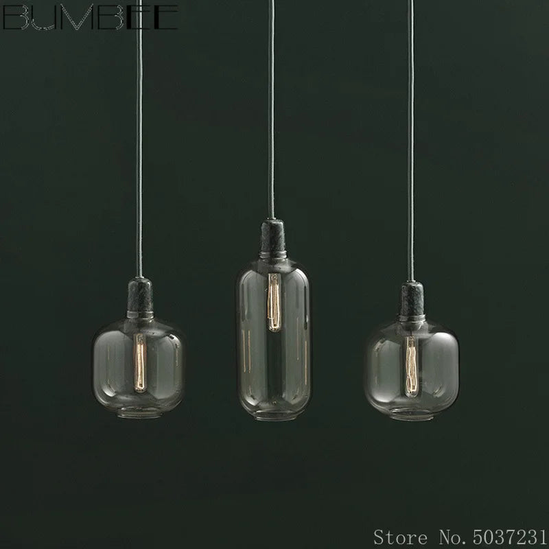 Glass pendant light with marble detail, elegant industrial design