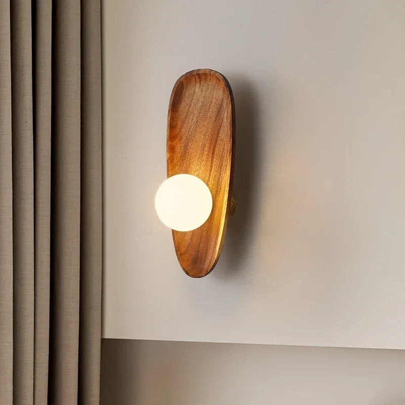 Natural wood wall lamp with vintage glass shade