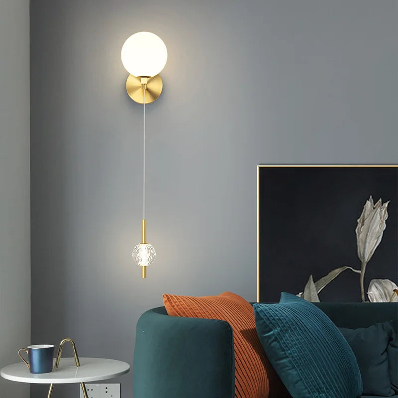 Modern brass wall light with 3 interchangeable shades
