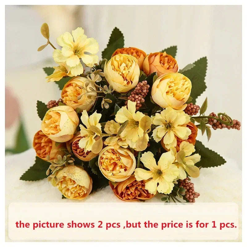 Wedding decoration with artificial silk flowers and green plants