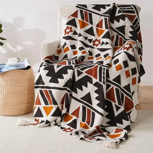 Soft boho knitted throw with tassels and geometric pattern