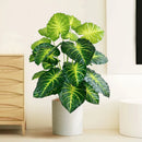 Artificial tropical turtle with decorative branches and leaves