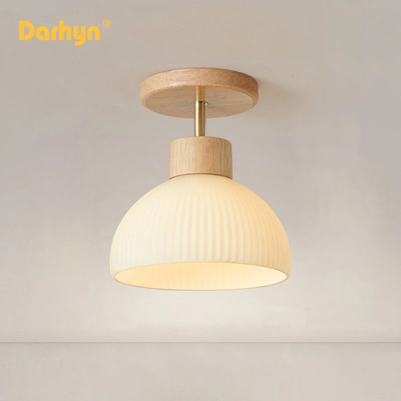 Simple wood chandelier with glass lampshade