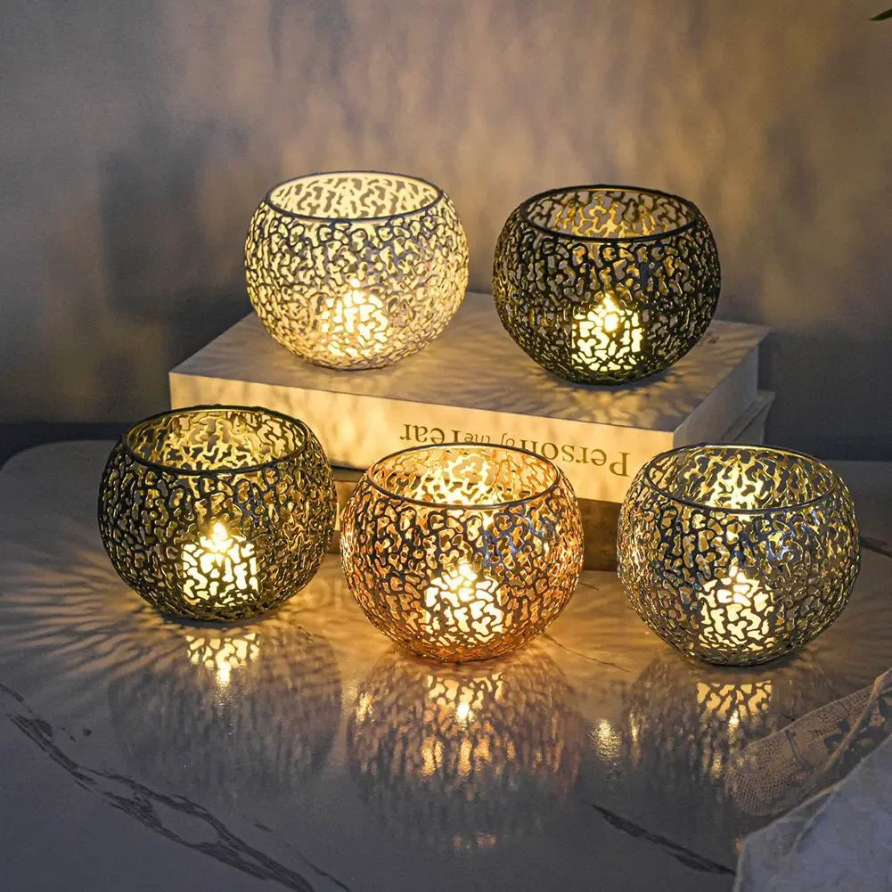 Gold metal candle holders with intricate design for elegant decor