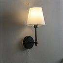 American retro wall light in black and gold linen