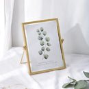 Floating glass photo frame with decorative pressed flowers