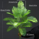 Large artificial plants palm, monstera and fern garden decoration