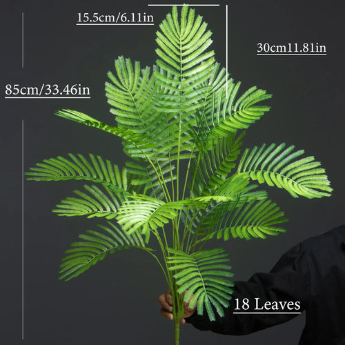 Large artificial plants palm, monstera and fern garden decoration