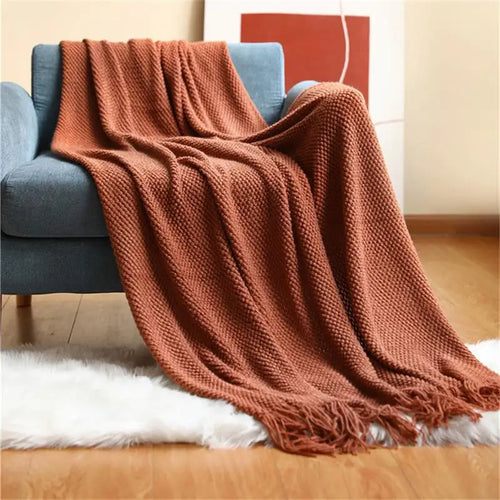 Nordic style knitted throw with pom poms for living room