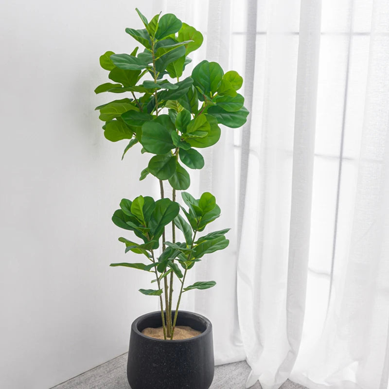 Plastic tropical tree with large branches for indoor decoration