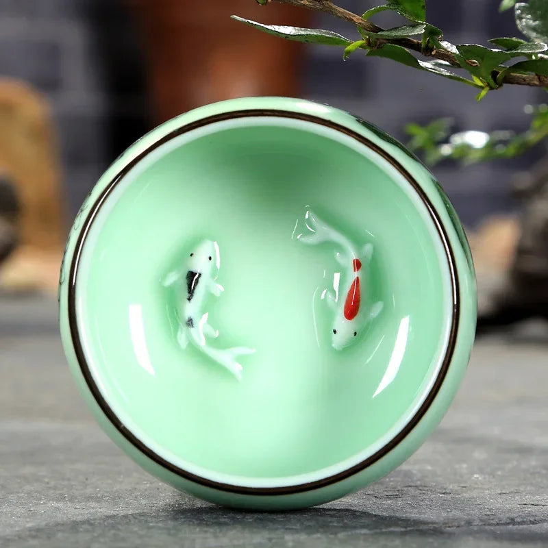 hand-painted celadon teacup with lotus and carp