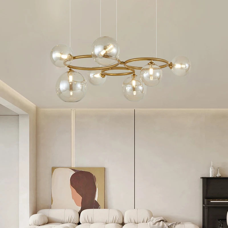 Modern chandelier with glass globe and round metal bar