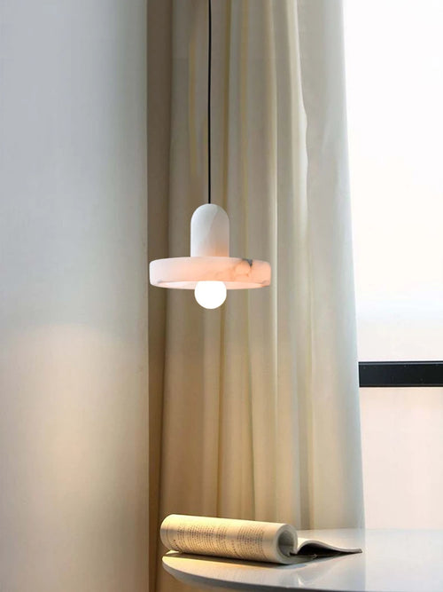 Minimalist marble and copper pendant light for modern interiors