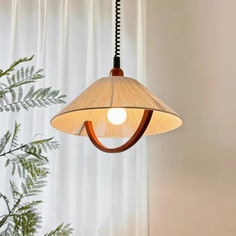 Retractable cotton and wood pendant light for interiors
