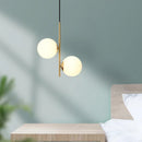 Modern glass and black brass pendant light with luminous design