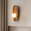 Natural wood wall light with vintage glass shade