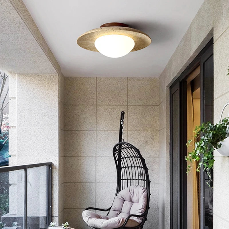 Wabi sabi travertine disc ceiling light for indoor and outdoor use