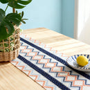 Bohemian table runner with Aztec pattern in beige and tassels