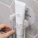 Toothbrush holder and bathroom organiser