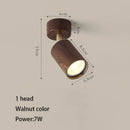 Surface mounted LED spotlight with replaceable bulb and adjustable heads