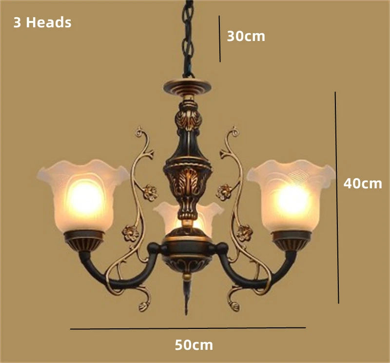 Vintage wrought iron chandelier with decorative glass shade