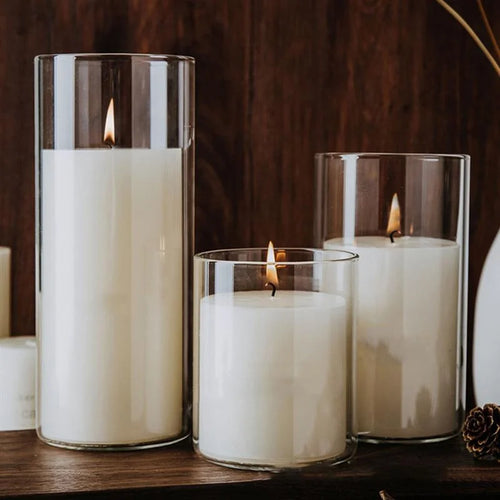 Transparent glass cup-shaped candle holders for festive home decoration