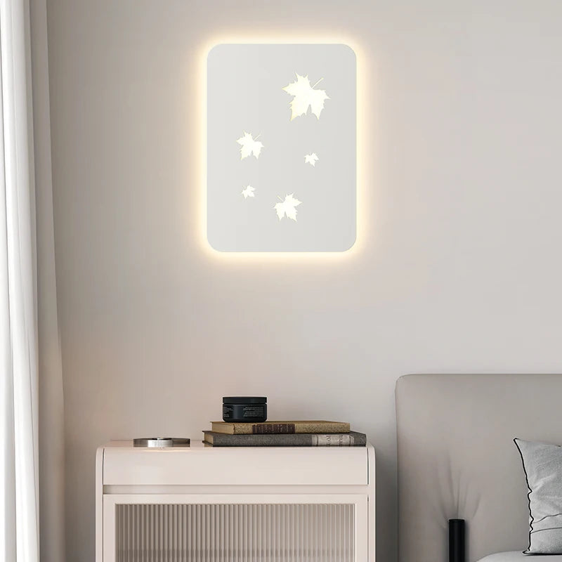 Dimmable metal wall light with maple leaf design