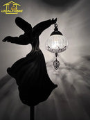Exotic bowl floor lamp with zen monk dancer