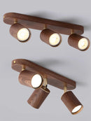 Surface mounted LED spotlight with replaceable bulb and adjustable heads