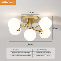 Modern glass ceiling light with round gold wave shade