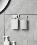 Wall-mounted organiser for toothbrushes and cup